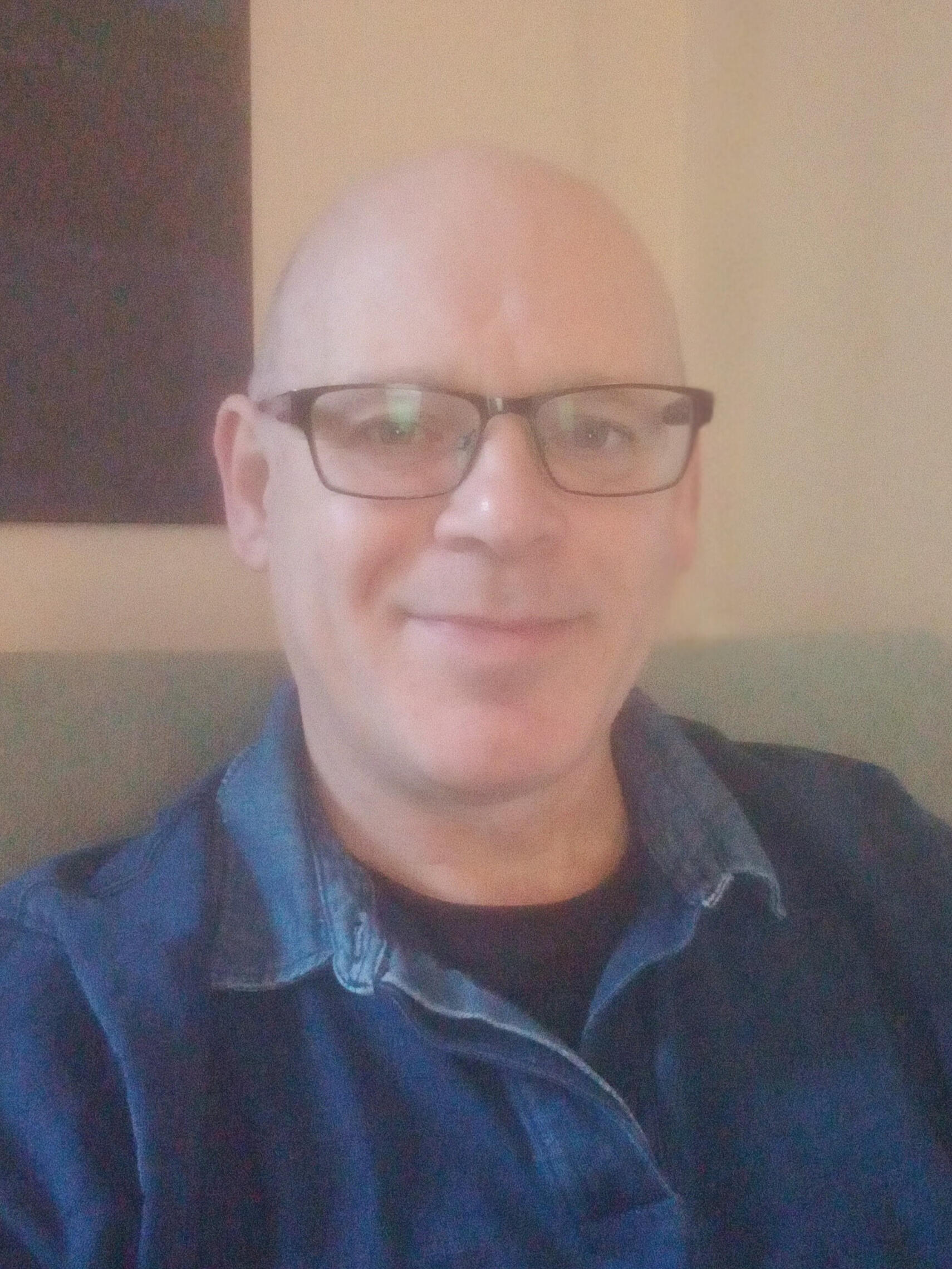 Picture of Andrew smiling in chair